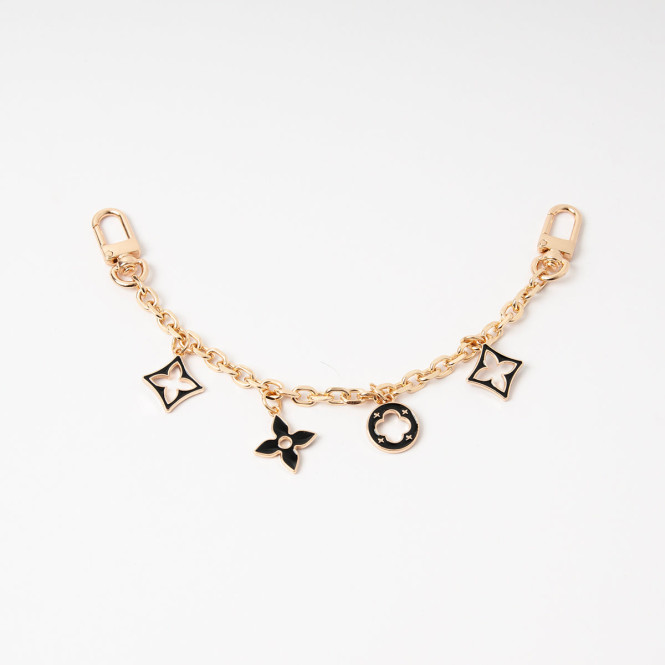 Charm länk med charms i guld och svart Rosenvinge
